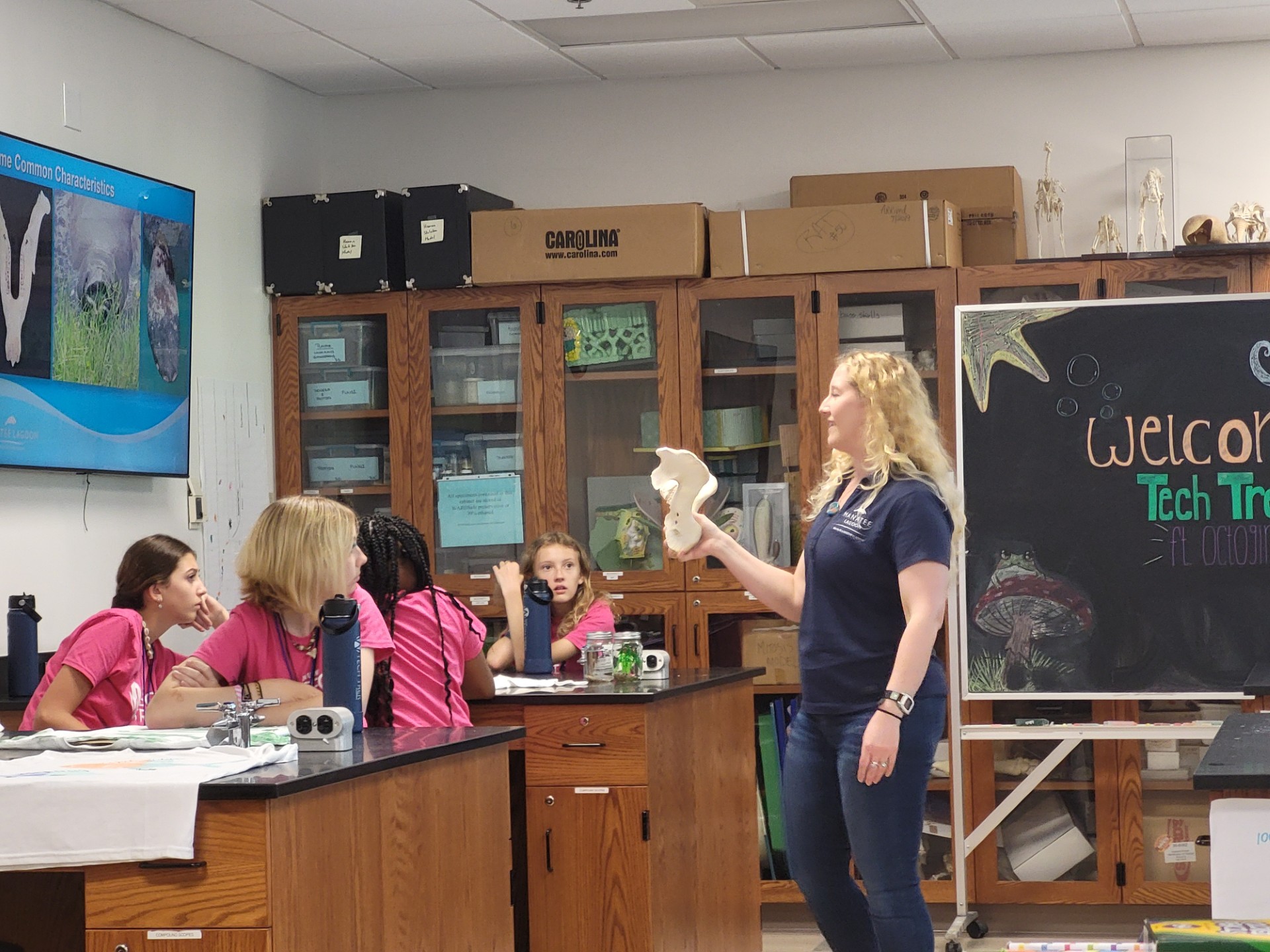 Rachel Shanker, M.S., shows the campers a manatee’s jawbone